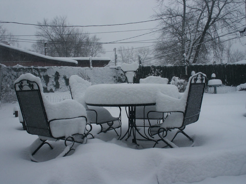 Some outdoor furniture that needs care because they've been snowed on