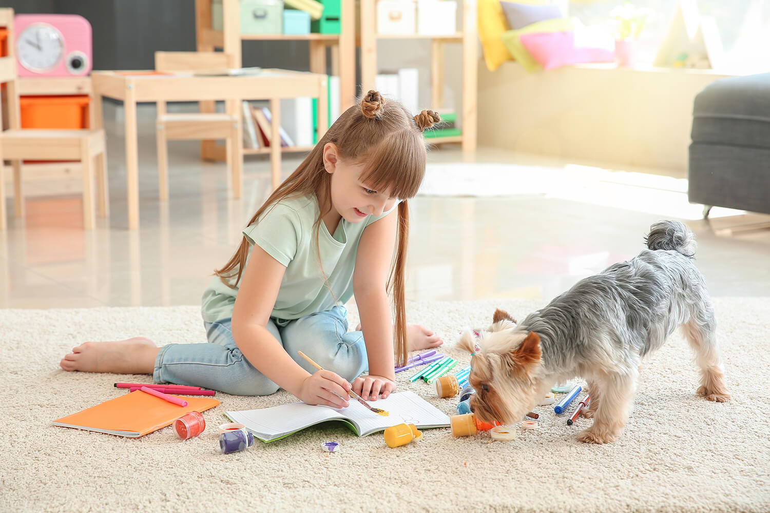 Girl and Dog playing on a professionally cleaned carpet.
